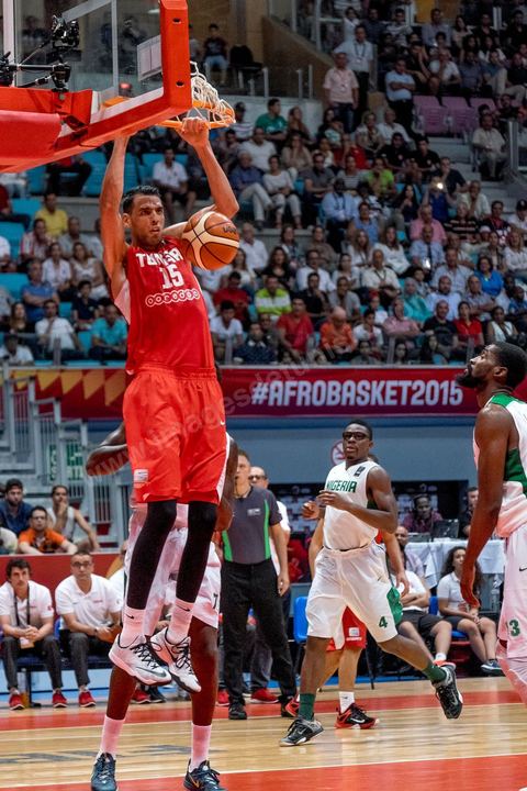 August 23, 2015: Salah Mejri, Tunisia’s famous No. 15, dominates the game at 2.17m; he has just been signed by the Dallas Mavericks and becomes the first Arab player in the NBA. Tunisia’s final group stage game against Nigeria at AfroBasket Tunisia 2015. Tunisia won (70–59) and finished first in its group.