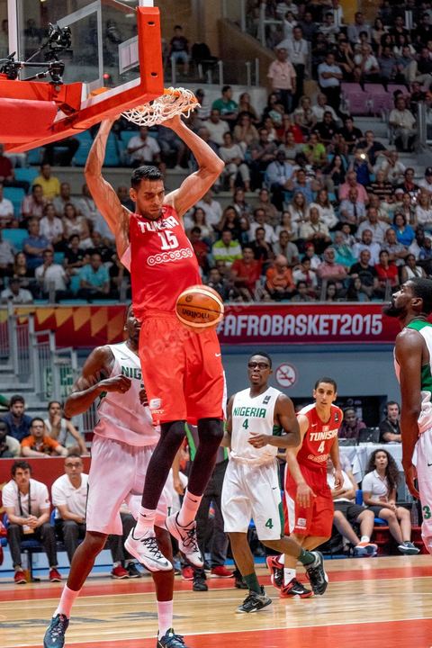 August 23, 2015: Salah Mejri, Tunisia’s famous No. 15, dominates the game at 2.17m; he has just been signed by the Dallas Mavericks and becomes the first Arab player in the NBA. Tunisia’s final group stage game against Nigeria at AfroBasket Tunisia 2015. Tunisia won (70–59) and finished first in its group.