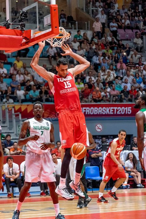 August 23, 2015: Salah Mejri, Tunisia’s famous No. 15, dominates the game at 2.17m; he has just been signed by the Dallas Mavericks and becomes the first Arab player in the NBA. Tunisia’s final group stage game against Nigeria at AfroBasket Tunisia 2015. Tunisia won (70–59) and finished first in its group.