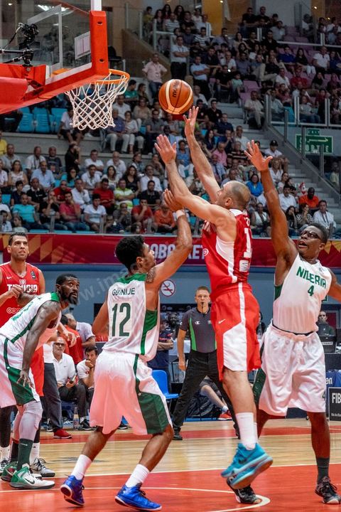 August 23, 2015: Amine Rzig scores a basket during Tunisia's final group-stage game against Nigeria at AfroBasket Tunisia 2015. Tunisia won (70-59) and finished first in its group.