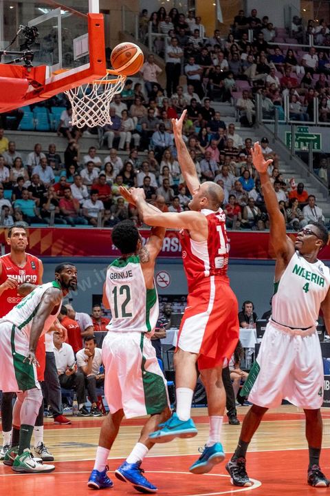 August 23, 2015: Amine Rzig scores a basket during Tunisia's final group-stage game against Nigeria at AfroBasket Tunisia 2015. Tunisia won (70-59) and finished first in its group.