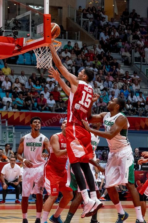 August 23, 2015: Salah Mejri, Tunisia’s famous No. 15, dominates the game at 2.17m; he has just been signed by the Dallas Mavericks and becomes the first Arab player in the NBA. Tunisia’s final group stage game against Nigeria at AfroBasket Tunisia 2015. Tunisia won (70–59) and finished first in its group.