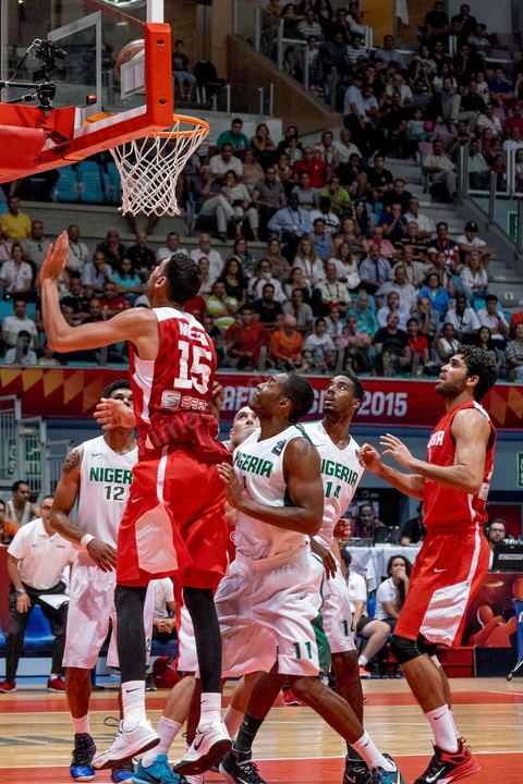 August 23, 2015: Salah Mejri, Tunisia’s famous No. 15, dominates the game at 2.17m; he has just been signed by the Dallas Mavericks and becomes the first Arab player in the NBA. Tunisia’s final group stage game against Nigeria at AfroBasket Tunisia 2015. Tunisia won (70–59) and finished first in its group.