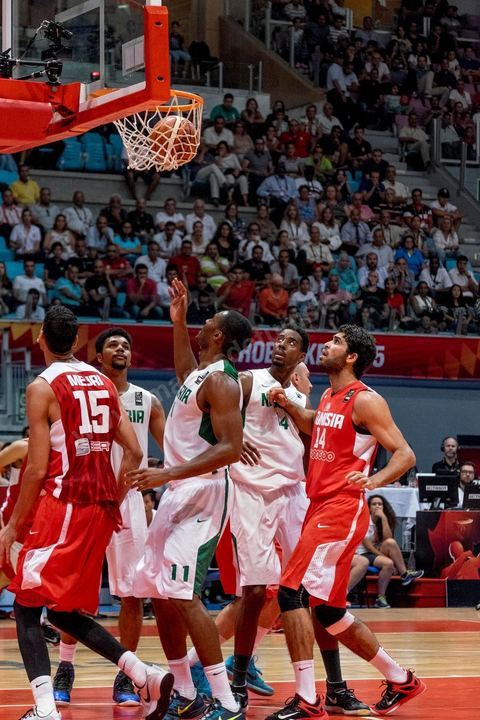 August 23, 2015: Salah Mejri, Tunisia’s famous No. 15, dominates the game at 2.17m; he has just been signed by the Dallas Mavericks and becomes the first Arab player in the NBA. Tunisia’s final group stage game against Nigeria at AfroBasket Tunisia 2015. Tunisia won (70–59) and finished first in its group.