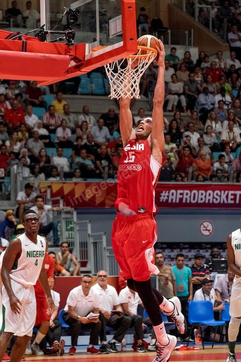 August 23, 2015: Salah Mejri, Tunisia’s famous No. 15, dominates the game at 2.17m; he has just been signed by the Dallas Mavericks and becomes the first Arab player in the NBA. Tunisia’s final group stage game against Nigeria at AfroBasket Tunisia 2015. Tunisia won (70–59) and finished first in its group.
