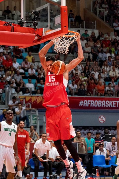 August 23, 2015: Salah Mejri, Tunisia’s famous No. 15, dominates the game at 2.17m; he has just been signed by the Dallas Mavericks and becomes the first Arab player in the NBA. Tunisia’s final group stage game against Nigeria at AfroBasket Tunisia 2015. Tunisia won (70–59) and finished first in its group.