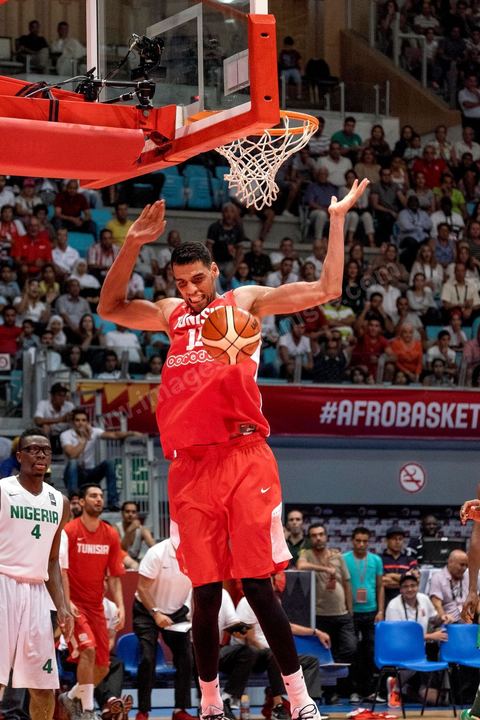 August 23, 2015: Salah Mejri, Tunisia’s famous No. 15, dominates the game at 2.17m; he has just been signed by the Dallas Mavericks and becomes the first Arab player in the NBA. Tunisia’s final group stage game against Nigeria at AfroBasket Tunisia 2015. Tunisia won (70–59) and finished first in its group.