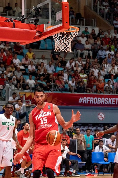 August 23, 2015: Salah Mejri, Tunisia’s famous No. 15, dominates the game at 2.17m; he has just been signed by the Dallas Mavericks and becomes the first Arab player in the NBA. Tunisia’s final group stage game against Nigeria at AfroBasket Tunisia 2015. Tunisia won (70–59) and finished first in its group.