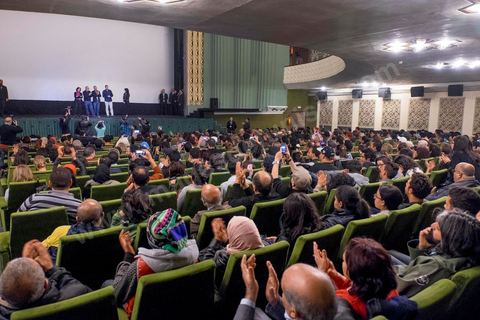 November 26, 2015: As part of the JCC (Carthage Film Festival), the Arab-African Film Festival in Tunis, the first screening in a Muslim country of the film “Much Loved” by Moroccan director Nabil Ayouch took place. Two days after the terrorist attack on a presidential police bus just a few hundred meters from the JCC movie theaters, the screening of “Much Loved” became a double challenge. JCC Director Brahim Eltaief and Nabil Ayouch were determined to keep the screening on the schedule, just as they did for the rest of the festival. The theater filled with more than a thousand film enthusiasts eager to meet Nabil Ayouch and see the Arabic-language premiere of this excellent film, which candidly yet masterfully portrays the reality of Moroccan sex workers. The screening was followed by a press conference.