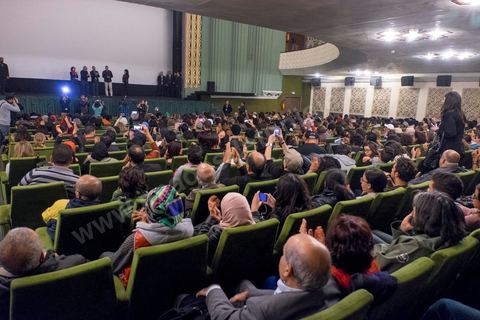 November 26, 2015: As part of the JCC (Carthage Film Festival), the Arab-African Film Festival in Tunis, the first screening in a Muslim country of the film “Much Loved” by Moroccan director Nabil Ayouch took place. Two days after the terrorist attack on a presidential police bus just a few hundred meters from the JCC movie theaters, the screening of “Much Loved” became a double challenge. JCC Director Brahim Eltaief and Nabil Ayouch were determined to keep the screening on the schedule, just as they did for the rest of the festival. The theater filled with more than a thousand film enthusiasts eager to meet Nabil Ayouch and see the Arabic-language premiere of this excellent film, which candidly yet masterfully portrays the reality of Moroccan sex workers. The screening was followed by a press conference.