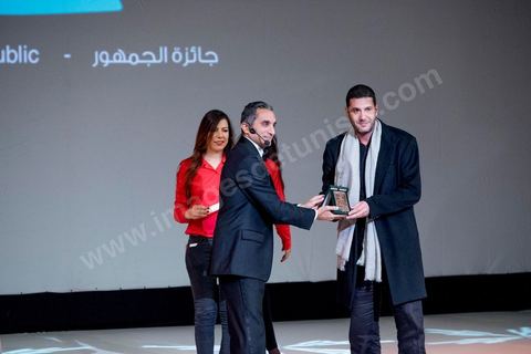 November 28, 2015: Bassem Youssef, the master of ceremonies, presented Nabil Ayouch with the Audience Award for his film "Much Loved." The closing ceremony of the JCC took place at the Municipal Theater of Tunis, in the heart of the capital, which had been devastated just a few days earlier by a suicide terrorist attack that killed 12 members of the presidential guard. The ceremony, moved up due to a curfew, served as a tribute to the culture that had stood up to terror throughout the week and provided an opportunity to honor artists and filmmakers from the Arab-African world. 
