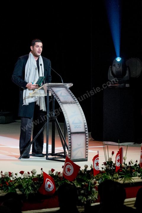 28 novembre 2015 : Nabil Ayouch a reçu le Prix du Public pour son film "Much Loved". Cérémonie de cloture des JCC au théâtre municipal de Tunis au coeur de la capitale meutrie il y a quelques jours à peine par une attaque suicide terroriste qui a fait 12 morts parmis les policiers de la garde présidentielle. La cérémonie avancée pour cause de couvre feu a été un moment d'hommage à la culture qui a su faire face à la terreur durant cette semaine et l'occasion de primée les artistes et réalisateur du monde arabo-africain. 