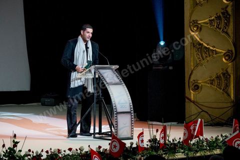 28 novembre 2015 : Nabil Ayouch a reçu le Prix du Public pour son film "Much Loved". Cérémonie de cloture des JCC au théâtre municipal de Tunis au coeur de la capitale meutrie il y a quelques jours à peine par une attaque suicide terroriste qui a fait 12 morts parmis les policiers de la garde présidentielle. La cérémonie avancée pour cause de couvre feu a été un moment d'hommage à la culture qui a su faire face à la terreur durant cette semaine et l'occasion de primée les artistes et réalisateur du monde arabo-africain. 