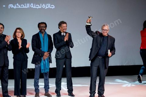 November 28, 2015: Brahim Eltaief, Director of the JCC, presents the Jury Prize to Nabil AYouch, the Moroccan director of the film "Much Loved." The closing ceremony of the JCC took place at the Municipal Theater of Tunis, in the heart of the capital, which had been devastated just a few days earlier by a suicide terrorist attack that killed 12 members of the presidential guard. The ceremony, moved up due to a curfew, served as a tribute to the culture that stood up to terror throughout the week and provided an opportunity to honor artists and filmmakers from the Arab-African world. 