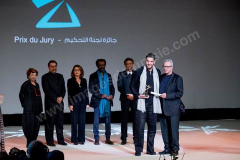 November 28, 2015: Brahim Eltaief, Director of the JCC, presents the Jury Prize to Nabil AYouch, the Moroccan director of the film "Much Loved." The closing ceremony of the JCC took place at the Municipal Theater of Tunis, in the heart of the capital, which had been devastated just a few days earlier by a suicide terrorist attack that killed 12 members of the presidential guard. The ceremony, moved up due to a curfew, served as a tribute to the culture that stood up to terror throughout the week and provided an opportunity to honor artists and filmmakers from the Arab-African world. 