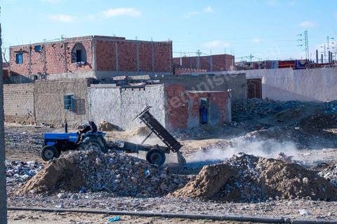 January 22, 2016: Between the famous working-class and revolutionary neighborhoods of Ezzouhour and Ennour on the hills above Kasserine, the neighborhoods continue to grow in a haphazard manner. The Karma neighborhood is one of the most deprived; its residents live amid piles of trash, and some are still waiting to be connected to the water supply. In the distance, Mount Chambi dominates the horizon, serving as a reminder of the presence and danger of terrorism.