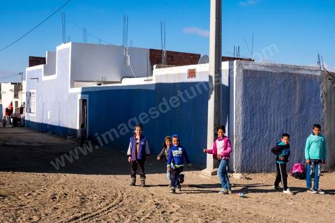 January 22, 2016: Between the famous working-class and revolutionary neighborhoods of Ezzouhour and Ennour on the hills above Kasserine, the neighborhoods continue to grow in a haphazard manner. The Karma neighborhood is one of the most deprived; its residents live amid piles of trash, and some are still waiting to be connected to the water supply. In the distance, Mount Chambi dominates the horizon, serving as a reminder of the presence and danger of terrorism.