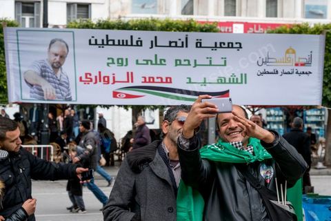 January 14, 2017: Pro-Palestine booth. Tunisians celebrate the 6th anniversary of the Revolution with a certain sense of gloom on Habib Bourguiba Avenue in Tunis. Few political leaders and organizations in Tunisia marked the 6th anniversary of the January 14, 2011, revolution on Saturday, as a sense of disillusionment is spreading across the country.
