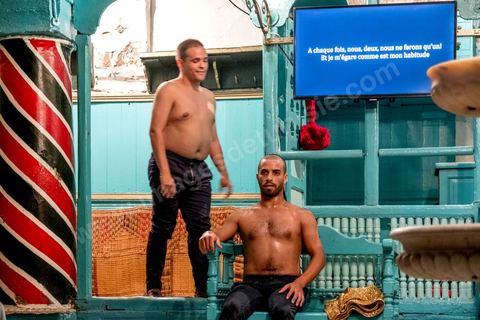October 4, 2017: Dream City in the medina of Tunis. A dance performance by Rochdi Belgasmi in a traditional hammam.
“Arous Oueslat”: From sexuality to dance, it’s almost just one step. And from dance to debauchery, it’s just two steps. Or three. In the space between them, Rochdi Belgasmi’s work continually revisits the gray areas of their shared memory. It is through Selim, the son of a prostitute from the late 18th century, that Rochdi Belgasmi explores here the masculine body and its repressed sexuality. The character of Selim appears on stage, in this hammam, to bear witness but also to manipulate. These are the laws—his laws—of hospitality. Between the attraction of one and the rejection of the other, the performance holds up an invisible mirror to the sociality of the prostitute’s body and its masculine fantasy in Arab-Muslim society, but also to the body of the city and its imaginaries, its erogenous zones, and its visceral connections.