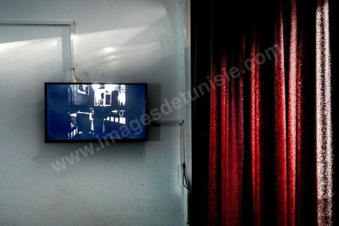 October 4, 2017: Dream City, Tunis Medina. Video installation by 
Fakhri el Ghezal titled “Héni éltéli”: “Wherever it falls, Fakhri El Ghezal’s gaze lends its solitude to more than one image. This video project unfolds, from one screen to the next, like so many variations on a single theme: drawing from everyday life, the videographer has decided to explore, day by day and without giving it too much thought, the realms of the intimate and the fictional. Armed with his cell phone, he captures—in varying durations—what passes by, comes to be, and unravels before his eyes. Between the routine and the isolation to which his well-oiled routine confines him; between death, which suddenly intrudes upon this daily life, and the grieving process that begins, certain threads of the artist’s post-prison experience replay in a loop. Bathed in black and white that yields as much to the present as to memory, Fakhri El Ghezal’s video work invites the viewer to keep their “third eye” open.”