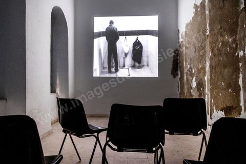 October 4, 2017: Dream City, Tunis Medina. Video installation by 
Fakhri el Ghezal titled “Héni éltéli”: “Wherever it falls, Fakhri El Ghezal’s gaze lends its solitude to more than one image. This video project unfolds, from one screen to the next, like so many variations on a single theme: drawing from everyday life, the videographer has decided to explore, day by day and without giving it too much thought, the realms of the intimate and the fictional. Armed with his cell phone, he captures—in varying durations—what passes by, comes to be, and unravels before his eyes. Between the routine and the isolation to which his well-oiled routine confines him; between death, which suddenly intrudes upon this daily life, and the grieving process that begins, certain threads of the artist’s post-prison experience replay in a loop. Bathed in black and white that yields as much to the present as to memory, Fakhri El Ghezal’s video work invites the viewer to keep their “third eye” open.”