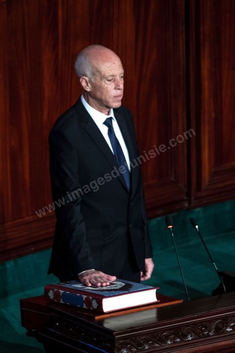 October 23, 2019: Kais Saied, the new president of the republic elected on October 13, arrived at the Assembly of the Representatives of the People to take the oath of office and deliver a speech. Before a packed chamber—including members of parliament, government officials, political figures, and ambassadors— Kais Saied declared that Tunisia had carried out a “true revolution, in a new sense of the word, because revolutions are generally waged against legitimacy, but what happened in Tunisia was a true revolution that utilized the very tools of legitimacy themselves.” In his view, “everyone here bears a responsibility—the responsibility to respond to the people in their demand for freedom and dignity. The wait has been all too long, and no one has the right to disappoint them.”
