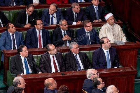 October 23, 2019: Kais Saied, the new president of the republic elected on October 13, arrived at the Assembly of the Representatives of the People to take the oath of office and deliver a speech. Before a packed chamber—including members of parliament, government officials, political figures, and ambassadors— Kais Saied declared that Tunisia had carried out a “true revolution, in a new sense of the word, because revolutions are generally waged against legitimacy, but what happened in Tunisia was a true revolution that utilized the very tools of legitimacy themselves.” In his view, “everyone here bears a responsibility—the responsibility to respond to the people in their demand for freedom and dignity. The wait has been all too long, and no one has the right to disappoint them.”