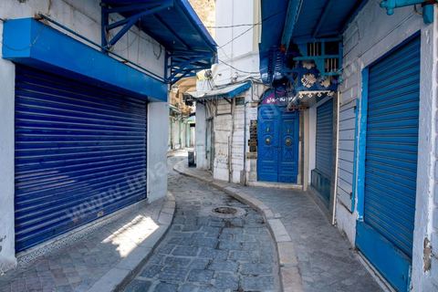 April 4, 2020: The Medina of Tunis is deserted. Jamaa Ez Zitouna Street, the main thoroughfare of the Medina of Tunis and a popular tourist street, is empty, with all the shops closed during the government-imposed lockdown due to COVID-19. A curfew was also in effect during this period, from 6:00 p.m. until 6:00 a.m. 