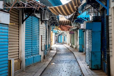 April 4, 2020: The Medina of Tunis is deserted. Jamaa Ez Zitouna Street, the main thoroughfare of the Medina of Tunis and a popular tourist street, is empty, with all the shops closed during the government-imposed lockdown due to COVID-19. A curfew was also in effect during this period, from 6:00 p.m. until 6:00 a.m. 