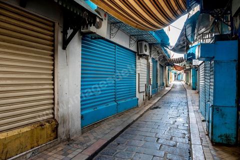April 4, 2020: The Medina of Tunis is deserted. Jamaa Ez Zitouna Street, the main thoroughfare of the Medina of Tunis and a popular tourist street, is empty, with all the shops closed during the government-imposed lockdown due to COVID-19. A curfew was also in effect during this period, from 6:00 p.m. until 6:00 a.m. 