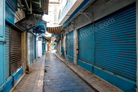 April 4, 2020: The Medina of Tunis is deserted. Jamaa Ez Zitouna Street, the main thoroughfare of the Medina of Tunis and a popular tourist street, is empty, with all the shops closed during the government-imposed lockdown due to COVID-19. A curfew was also in effect during this period, from 6:00 p.m. until 6:00 a.m. 
