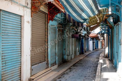 April 4, 2020: The Medina of Tunis is deserted. Jamaa Ez Zitouna Street, the main thoroughfare of the Medina of Tunis and a popular tourist street, is empty, with all the shops closed during the government-imposed lockdown due to COVID-19. A curfew was also in effect during this period, from 6:00 p.m. until 6:00 a.m. 