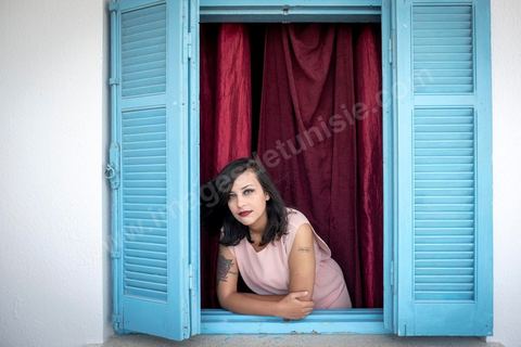 July 12, 2020: Profile of Emna Charki, a young Tunisian blogger facing legal charges for a Facebook post deemed to constitute “incitement to hatred between religions and a call for discrimination”; she faces up to three years in prison, with the verdict set for July 13. Here in her apartment while she’s in the process of moving—her landlord refusing to house a “kafir” (“unbeliever”)—she proudly displays her 2012 tattoo that reads “out law” (“outlaw”). On July 14, she was sentenced to six months in prison without parole for inciting hatred between religions and fined 2,000 dinars (€620) for desecration of the sacred. Her lawyers have filed an appeal. 