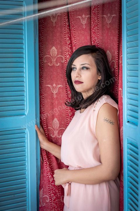 July 12, 2020: Profile of Emna Charki, a young Tunisian blogger facing legal charges for a Facebook post deemed to constitute “incitement to hatred between religions and a call for discrimination”; she faces up to three years in prison, with the verdict set for July 13. Here in her apartment while she’s in the process of moving—her landlord refusing to house a “kafir” (“unbeliever”)—she proudly displays her 2012 tattoo that reads “out law” (“outlaw”). On July 14, she was sentenced to six months in prison without parole for inciting hatred between religions and fined 2,000 dinars (€620) for desecration of the sacred. Her lawyers have filed an appeal. 