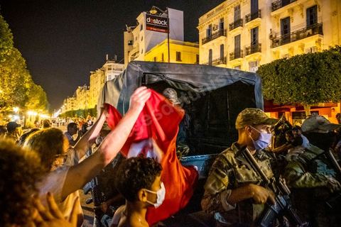 July 25, 2021: Following the broadcast of Kais Saied’s statement, several thousand Tunisians took to the streets to celebrate what appears to be a “constitutional coup” and to welcome the military personnel who had taken up positions at the top of Habib Bourguiba Avenue in Tunis.  President Kaïs Saïed convened an emergency meeting this evening with security and military leaders and senior officials, during which he announced several decisions “in accordance with the Constitution,” the main ones being the suspension of Parliament and all its activities, the dismissal of the head of government, the dissolution of the government, and the President of the Republic will appoint a new head of government and members of the government...