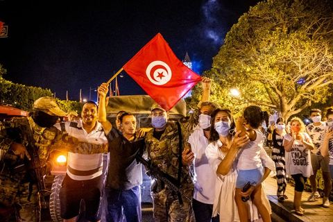 July 25, 2021: Following the broadcast of Kais Saied’s statement, several thousand Tunisians took to the streets to celebrate what appears to be a “constitutional coup” and to welcome the military personnel who had taken up positions at the top of Habib Bourguiba Avenue in Tunis.  President Kaïs Saïed convened an emergency meeting this evening with security and military leaders and senior officials, during which he announced several decisions “in accordance with the Constitution,” the main ones being the suspension of Parliament and all its activities, the dismissal of the head of government, the dissolution of the government, and the President of the Republic will appoint a new head of government and members of the government...
