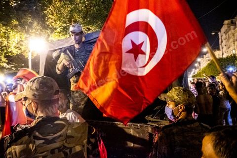 July 25, 2021: Following the broadcast of Kais Saied’s statement, several thousand Tunisians took to the streets to celebrate what appears to be a “constitutional coup” and to welcome the military personnel who had taken up positions at the top of Habib Bourguiba Avenue in Tunis.  President Kaïs Saïed convened an emergency meeting this evening with security and military leaders and senior officials, during which he announced several decisions “in accordance with the Constitution,” the main ones being the suspension of Parliament and all its activities, the dismissal of the head of government, the dissolution of the government, and the President of the Republic will appoint a new head of government and members of the government...
