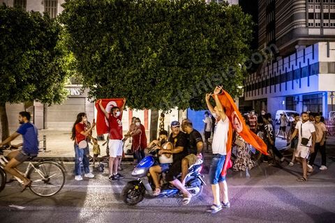 July 25, 2021: Following the broadcast of Kais Saied’s statement, several thousand Tunisians took to the streets to celebrate what appears to be a “constitutional coup” and to welcome the military personnel who had taken up positions at the top of Habib Bourguiba Avenue in Tunis.  President Kaïs Saïed convened an emergency meeting this evening with security and military leaders and senior officials, during which he announced several decisions “in accordance with the Constitution,” the main ones being the suspension of Parliament and all its activities, the dismissal of the head of government, the dissolution of the government, and the President of the Republic will appoint a new head of government and members of the government...