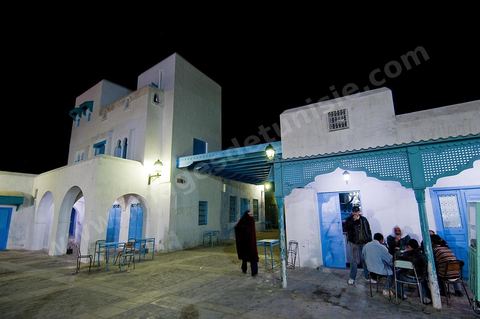 The Medina of Kairouan: an alleyway and a street scene at night