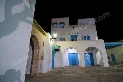 The Medina of Kairouan: an alleyway and a street scene at night