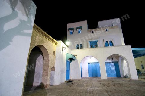 The Medina of Kairouan: an alleyway and a street scene at night