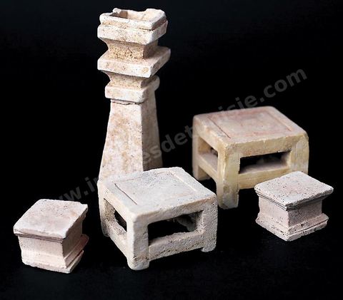 Miniature furniture carved from soft limestone: a table, stools, an altar, and an incense burner, replicating the wooden furnishings of a Punic interior (Douimès and Dermerch necropolises, Carthage, 6th century B.C., Carthage Museum).