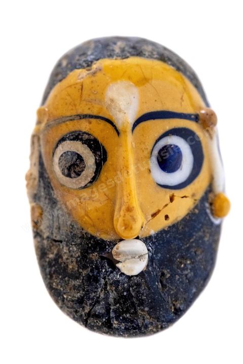 Men's amulet made of siliceous material.  National Museum of Carthage