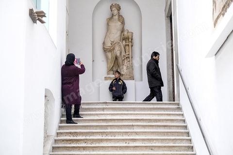 December 28, 2018, at 12:30 p.m.: On the palace’s grand staircase, the statue of Apollo welcomes visitors to the Bardo Museum. The small bullet hole in the white wall to the left of the statue serves as a reminder of the attack on March 18, 2015. Few works of art were damaged or affected by the attack, such as this large statue of Apollo. 
